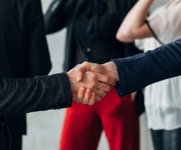 Handshake between two professionals symbolizing SEO partnership for Calgary businesses.