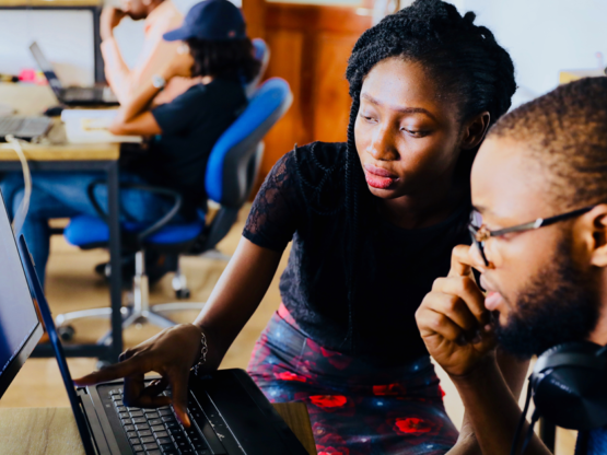 Man and Woman looking at a computer screen